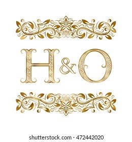 H and O vintage initials logo symbol. The letters are surrounded by ornamental elements. Wedding or business partners monogram in royal style.