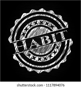 Habit chalk emblem written on a blackboard