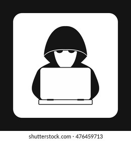 Hacker behind a computer icon in simple style isolated on white background. Cracking symbol