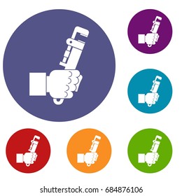 Hacksaw in man hand icons set
