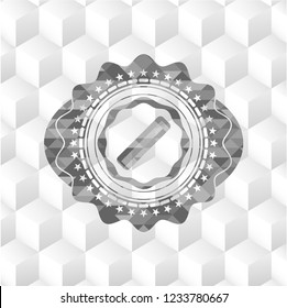 hair comb icon inside grey badge with geometric cube white background
