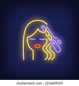 Hair curler curling woman hair neon sign. Hairdressing salon, style and fashion concept. Advertisement design. Night bright colorful billboard, light banner. Vector illustration in neon style.