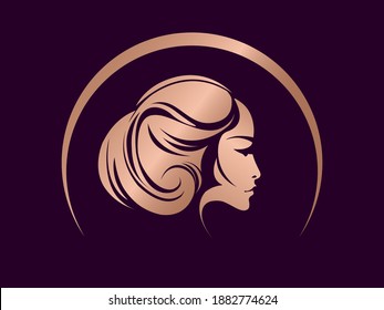 Hair salon, beauty studio logo.Wavy hairstyle blonde woman.Elegant makeup.Cosmetics and spa icon isolated on dark fund.Young lady portrait.Beautiful model face.Luxury,glamour style.Rose gold color.