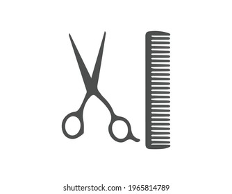 Hairdresser comb and scissors in black and white.