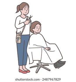 Hairdresser and customer cutting hair at the beauty salon