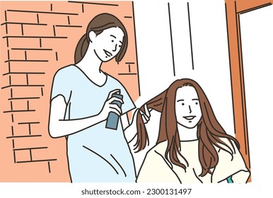 
Hairdresser and female customer spraying in beauty salon