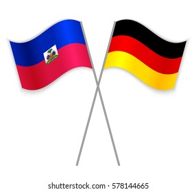 Haitian and German crossed flags. Haiti combined with Germany isolated on white. Language learning, international business or travel concept.