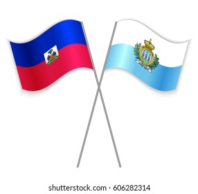 Haitian and Sammarinese crossed flags. Haiti combined with San Marino isolated on white. Language learning, international business or travel concept.