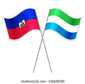 Haitian and Sierra Leonean crossed flags. Haiti combined with Sierra Leone isolated on white. Language learning, international business or travel concept.