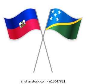 Haitian and Solomon Island crossed flags. Haiti combined with Solomon Islands isolated on white. Language learning, international business or travel concept.
