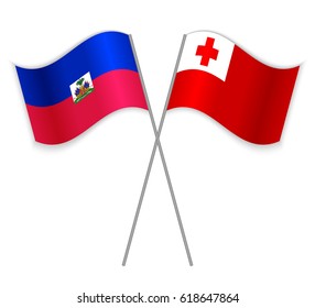 Haitian and Tongan crossed flags. Haiti combined with Tonga isolated on white. Language learning, international business or travel concept.