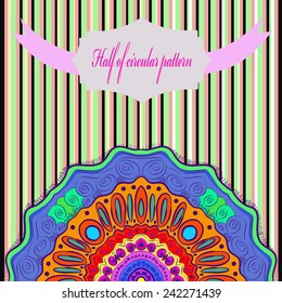 Half of colored circular arabesque, label, text on a black striped  background. Hand drawn.