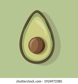 Halb geschnittener Avocado auf grünem Hintergrund.