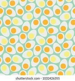 Half eggs with the yolk. Seamless vector background.