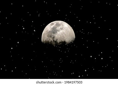 Half moon on black sky with shinning stars .