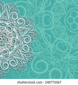 Half of white snowflake with abstract floral pattern on cyan background with place for your text