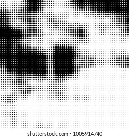 Halftone black and white abstract pattern of dots in black on a white background