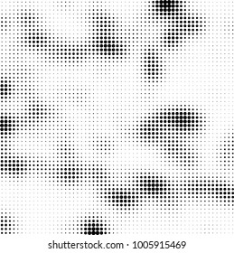 Halftone black and white abstract pattern of dots in black on a white background