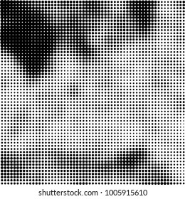 Halftone black and white abstract pattern of dots in black on a white background