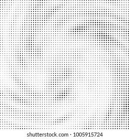 Halftone black and white abstract pattern of dots in black on a white background