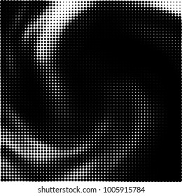 Halftone black and white abstract pattern of dots in black on a white background