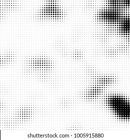 Halftone black and white abstract pattern of dots in black on a white background