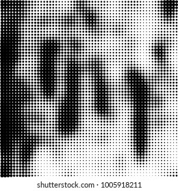 Halftone black and white abstract pattern of dots in black on a white background