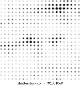 Halftone black and white abstract pattern of dots in black on a white background