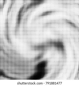 Halftone black and white abstract pattern of dots in black on a white background