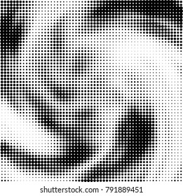 Halftone black and white abstract pattern of dots in black on a white background