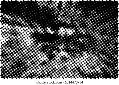 Halftone black and white grunge. Texture of dots scattered on a white background. Abstract pattern in vintage art style print on business cards, badges, labels. Vector monochrome elements