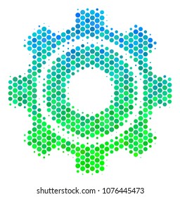 Halftone circle Cog icon. Pictogram in green and blue color hues on a white background. Vector concept of cog icon combined of sphere items.