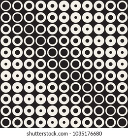 Halftone circles vector seamless pattern. Abstract geometric texture with size gradation of rings. Gradient transition effect monochrome background,