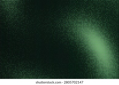 Halftone gradient texture with green illumination on dark background