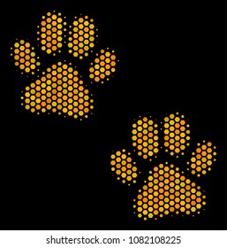 Halftone hexagon Paw Footprints icon. Bright golden pictogram with honeycomb geometric pattern on a black background. Vector mosaic of paw footprints icon composed of hexagon dots.