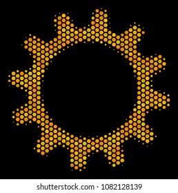 Halftone hexagonal Cogwheel icon. Bright golden pictogram with honeycomb geometric structure on a black background. Vector concept of cogwheel icon organized of hexagon items.