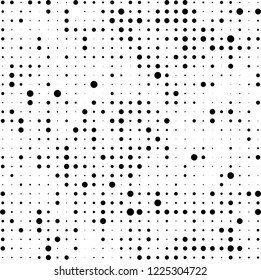 Halftone texture is black and white. The pattern of the ink points are randomly arranged. Vector monochrome background. Abstract the surface of chaos