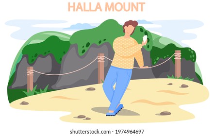 Hallasan mountain famous landmark of Jeju Island in south Korea. Extinct volcano in national park. Mountain is located in center of island and man tourist traveler takes selfie on natural showplace