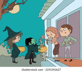 Halloween Adults give candy to children dressed up as ghosts for Halloween.