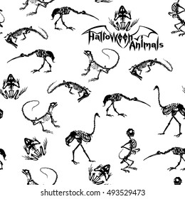 Halloween animals - black skeletons of reptiles (crocodiles, lizards, frogs), monkeys and birds (ostriches and herons) on white background. Seamless pattern.