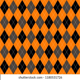 Halloween Argyle plaid. Scottish pattern in orange, black, gray and white  rhombuses. Scottish cage. Traditional Scottish background of diamonds . Seamless fabric texture. Vector illustration