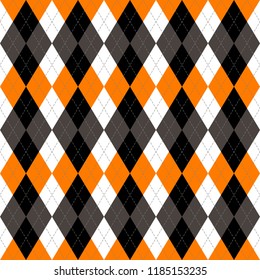 Halloween Argyle plaid. Scottish pattern in orange, black, gray and white  rhombuses. Scottish cage. Traditional Scottish background of diamonds . Seamless fabric texture. Vector illustration