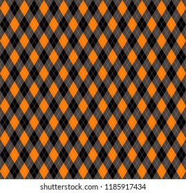 Halloween Argyle plaid. Scottish pattern in orange, black, gray and white  rhombuses. Scottish cage. Traditional Scottish background of diamonds . Seamless fabric texture. Vector illustration