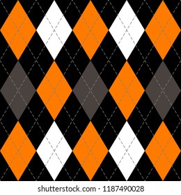 Halloween Argyle plaid. Scottish pattern in orange, black, gray and white  rhombuses. Scottish cage. Traditional Scottish background of diamonds . Seamless fabric texture. Vector illustration