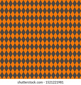 Halloween Argyle plaid. Scottish pattern in orange and grey  rhombuses. Scottish cage. Traditional Scottish background of diamonds . Seamless fabric texture. Vector illustration