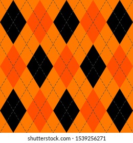 Halloween Argyle plaid. Scottish pattern in orange and black rhombuses. Scottish cage. Traditional Scottish background of diamonds . Seamless fabric texture. Vector illustration
