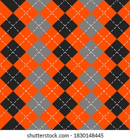 Halloween Argyle plaid. Scottish pattern in orange, black and gray rhombuses. Scottish cage. Traditional Scottish background of diamonds. Seamless fabric texture. Vector illustration