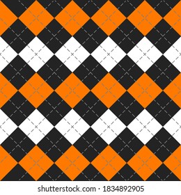 Halloween Argyle plaid. Scottish pattern in orange, black and white rhombuses. Scottish cage. Traditional Scottish background of diamonds. Seamless fabric texture. Vector illustration