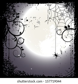 Halloween background. Full moon and a cobweb