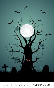 Halloween background with ominous tree in the cemetery